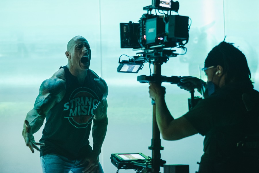 Anthony on Steadicam beside Dwayne Johnson on a music video set