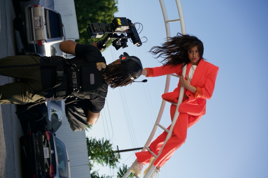 Anthony operating a camera rig mounted on a roller coaster