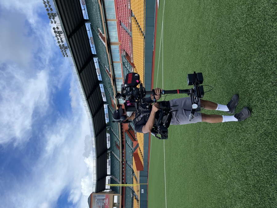 Anthony with a Steadicam on a stadium field