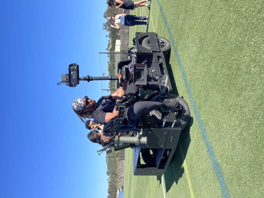 A camera vehicle rig on a football field at a night shoot